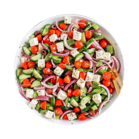 Greek Garden Salad. Fresh mixed leafy greens, tomatoes, cucumbers, onions, bell peppers, olives, and feta cheese, with a Crème Greek dressing.